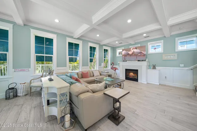 a living room with furniture fireplace and window