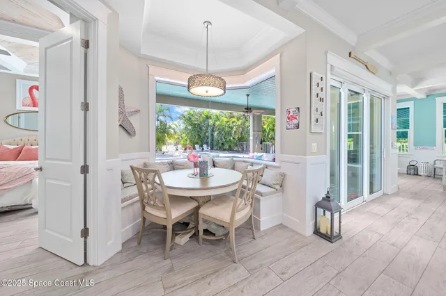 a view of a dining room with furniture window and outside view