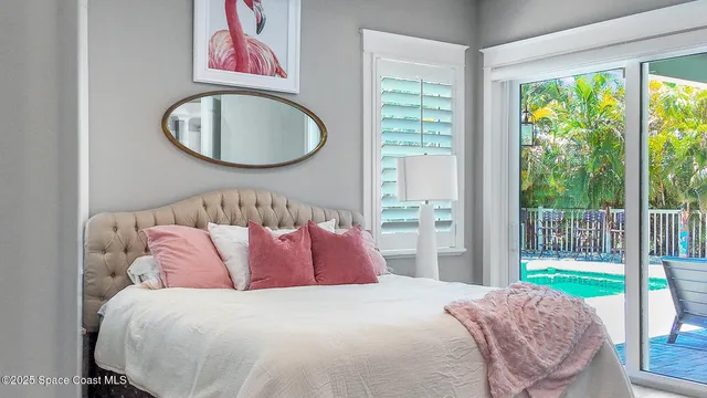 a bedroom with a bed and a chair