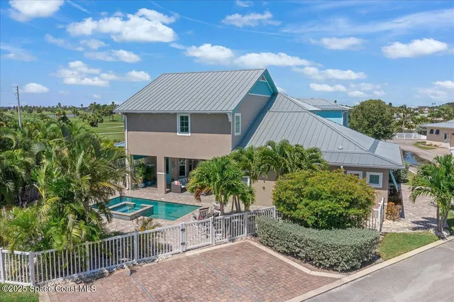 a house with lots of trees in the background