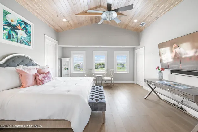 a bathroom with a sink mirror and a toilet