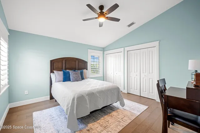 a bedroom with a bed and a table