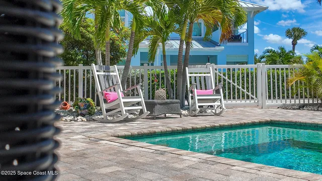 a view of house with a yard and garden