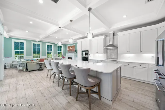 a kitchen with lots of counter top space a sink appliances and cabinets
