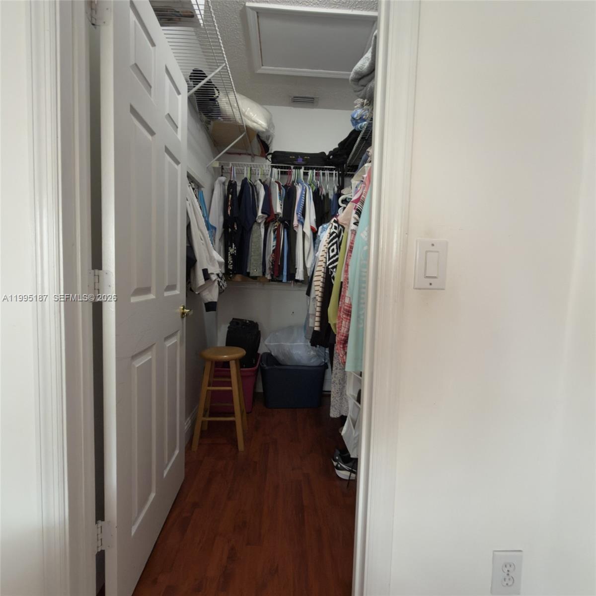 16029 Emerald Cove Road Weston, FL 33331 - Photo 15 of 20 a view of walk in closet with clothes and shoes