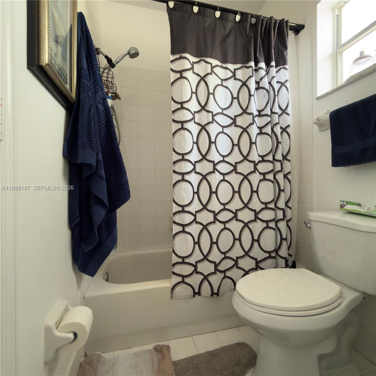 16029 Emerald Cove Road Weston, FL 33331 - Photo 17 of 20 a bathroom with a toilet and a shower