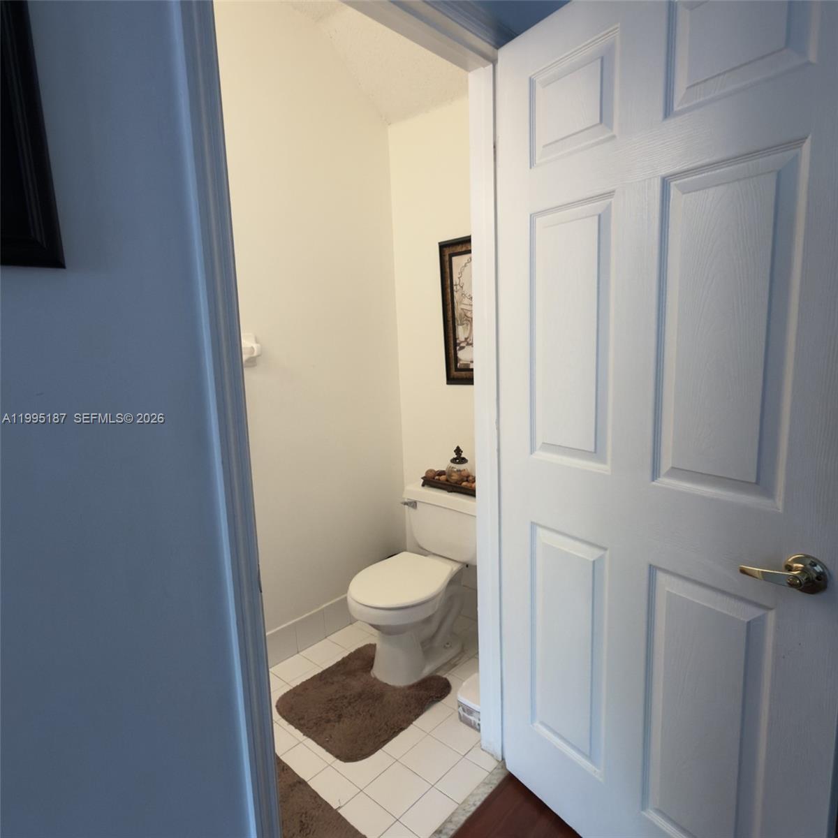 16029 Emerald Cove Road Weston, FL 33331 - Photo 18 of 20 a bathroom with a toilet and a shower