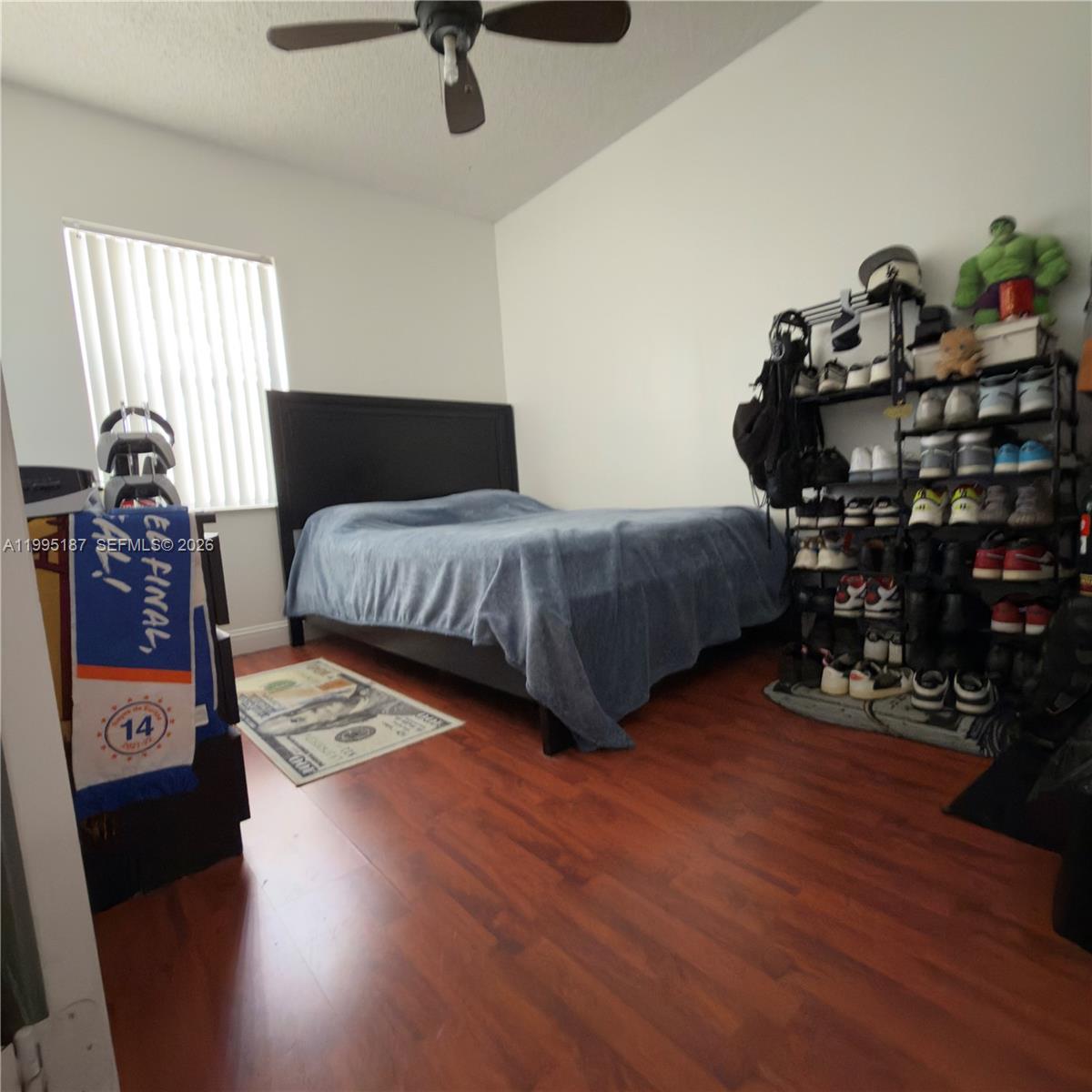 16029 Emerald Cove Road Weston, FL 33331 - Photo 19 of 20 a bedroom with a bed furniture and a window