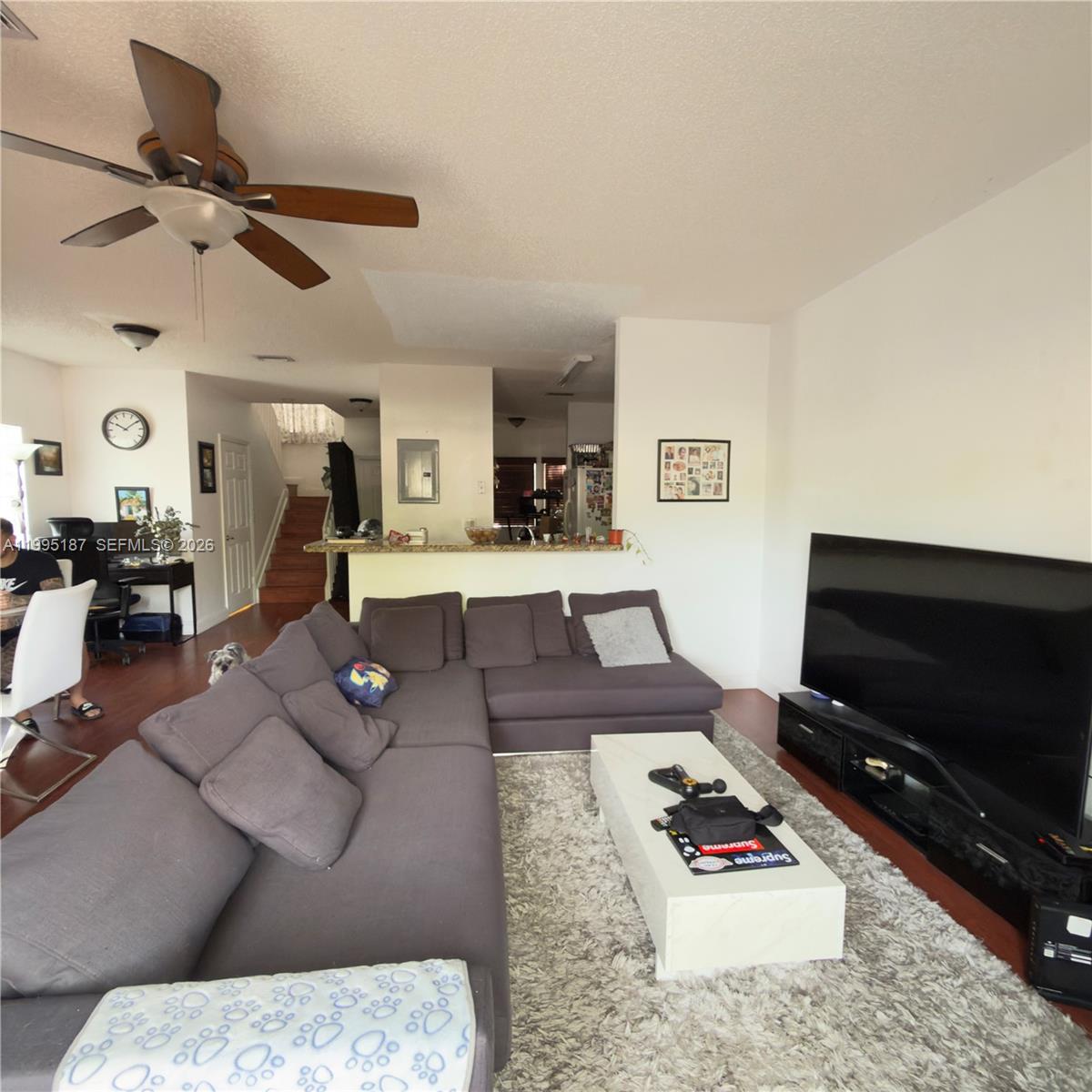 16029 Emerald Cove Road Weston, FL 33331 - Photo 5 of 20 a living room with furniture and a flat screen tv