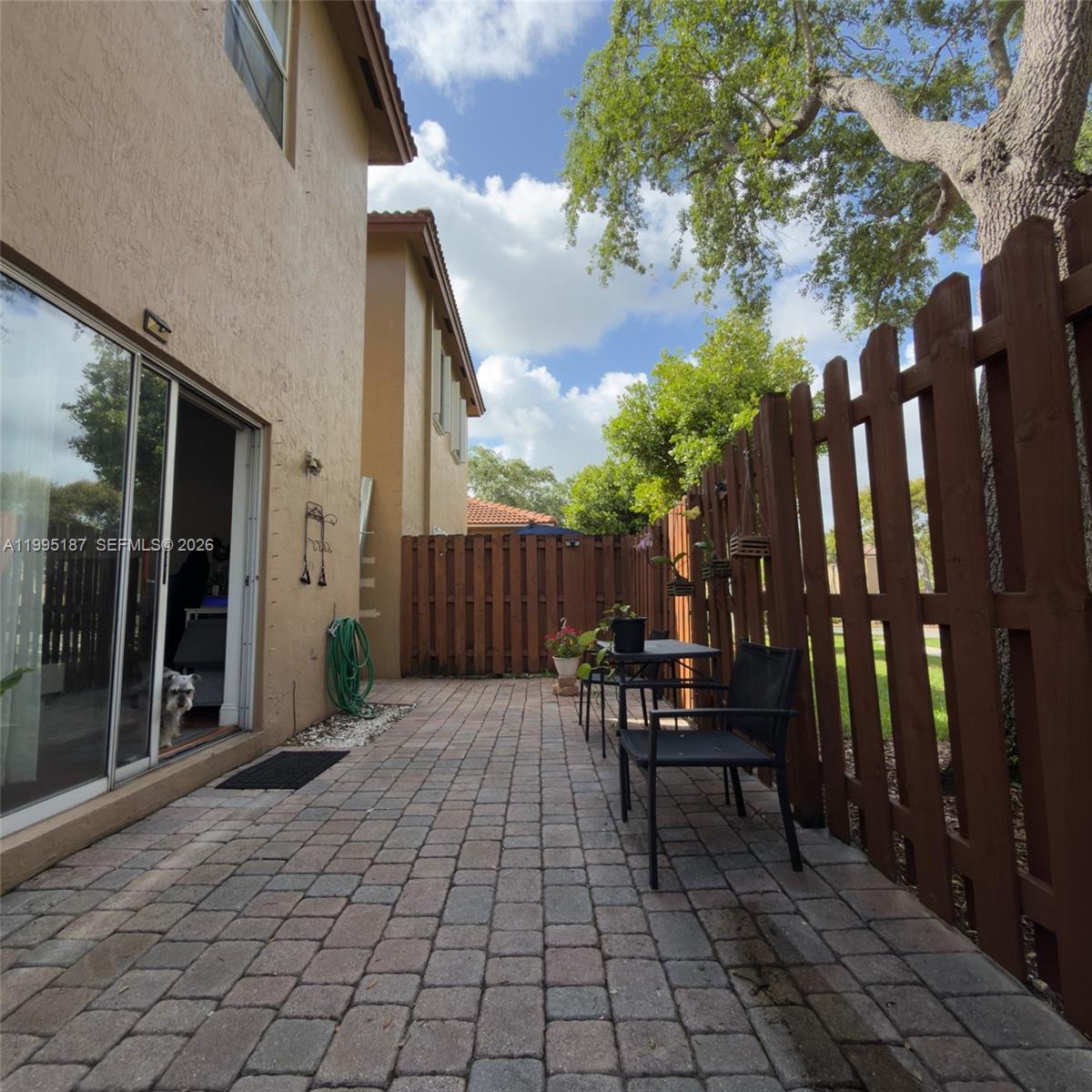 16029 Emerald Cove Road Weston, FL 33331 - Photo 7 of 20 a view of backyard with sitting area