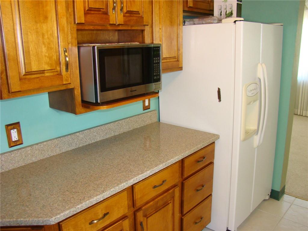 220 McGregor Drive Verona, PA 15147 - Photo 12 of 25 a kitchen with cabinets and stainless steel appliances