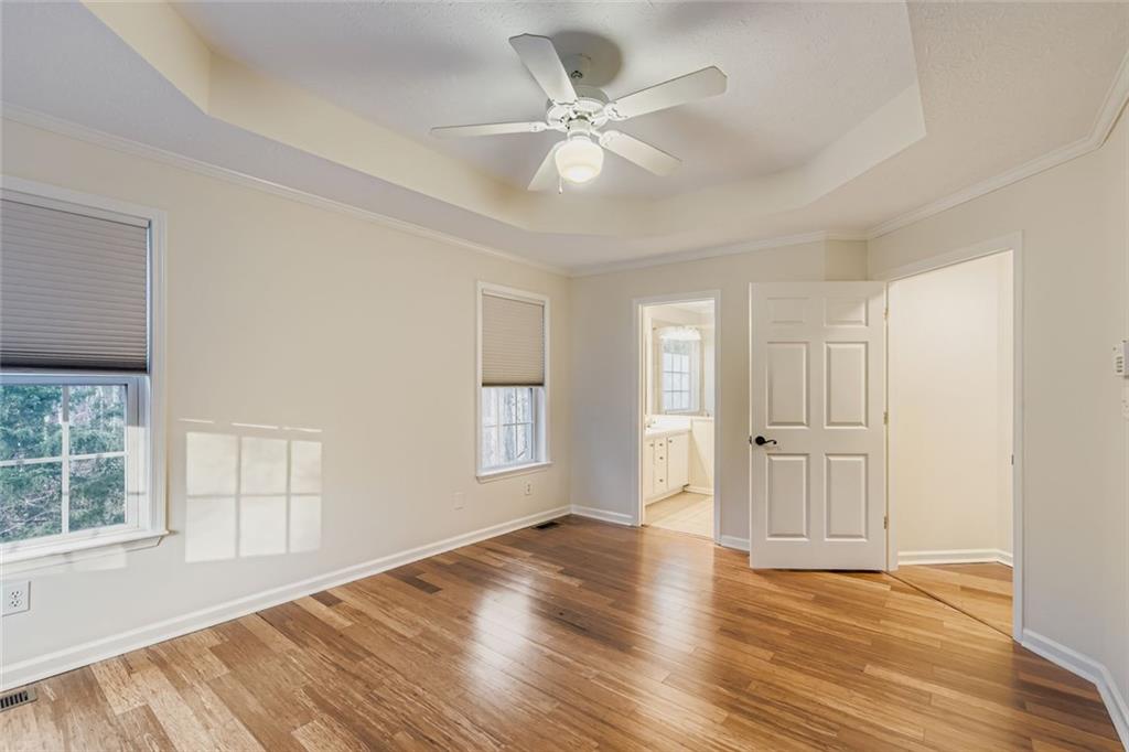 16 Inland Point Newnan, GA 30263 - Photo 11 of 34 wooden floor in an empty room with a window