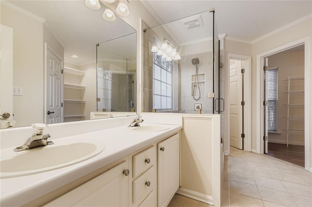 16 Inland Point Newnan, GA 30263 - Photo 12 of 34 a bathroom with a double vanity sink mirror double and shower