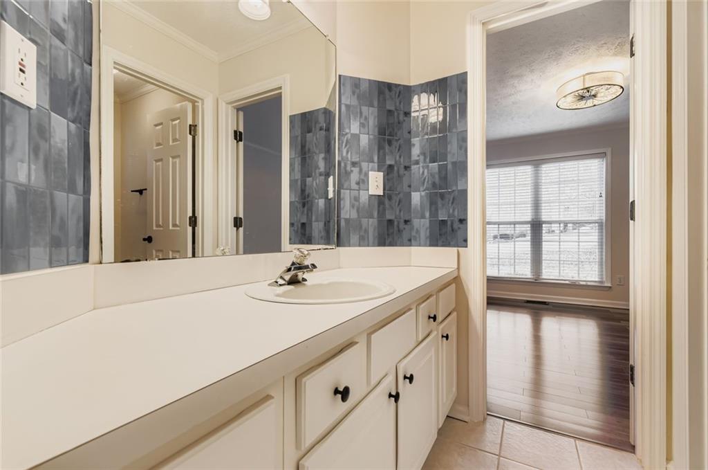 16 Inland Point Newnan, GA 30263 - Photo 14 of 34 a bathroom with a sink and a mirror