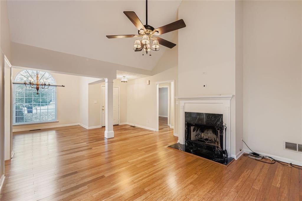 16 Inland Point Newnan, GA 30263 - Photo 2 of 34 a view of an empty room with wooden floor a fireplace and a window