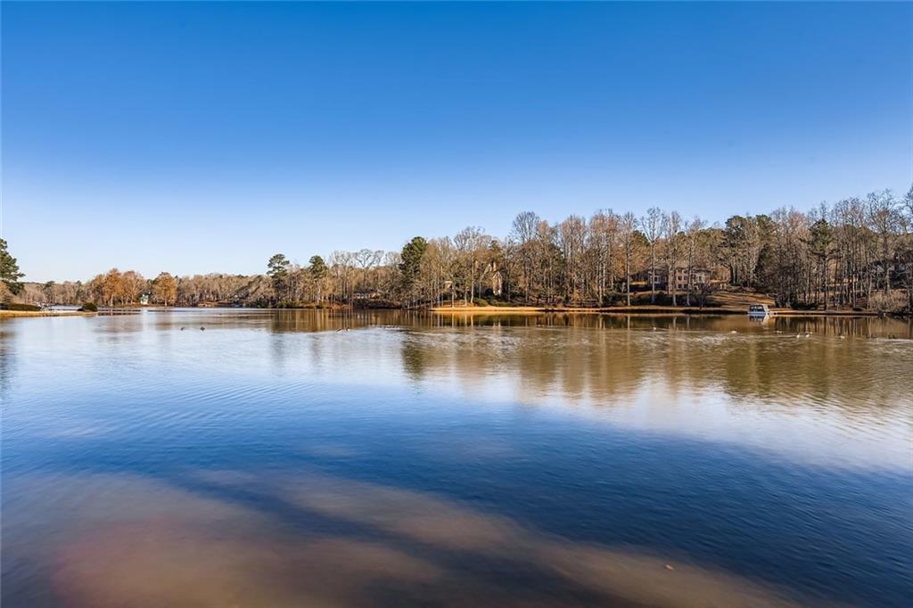 16 Inland Point Newnan, GA 30263 - Photo 26 of 34 a view of a lake with houses in the background
