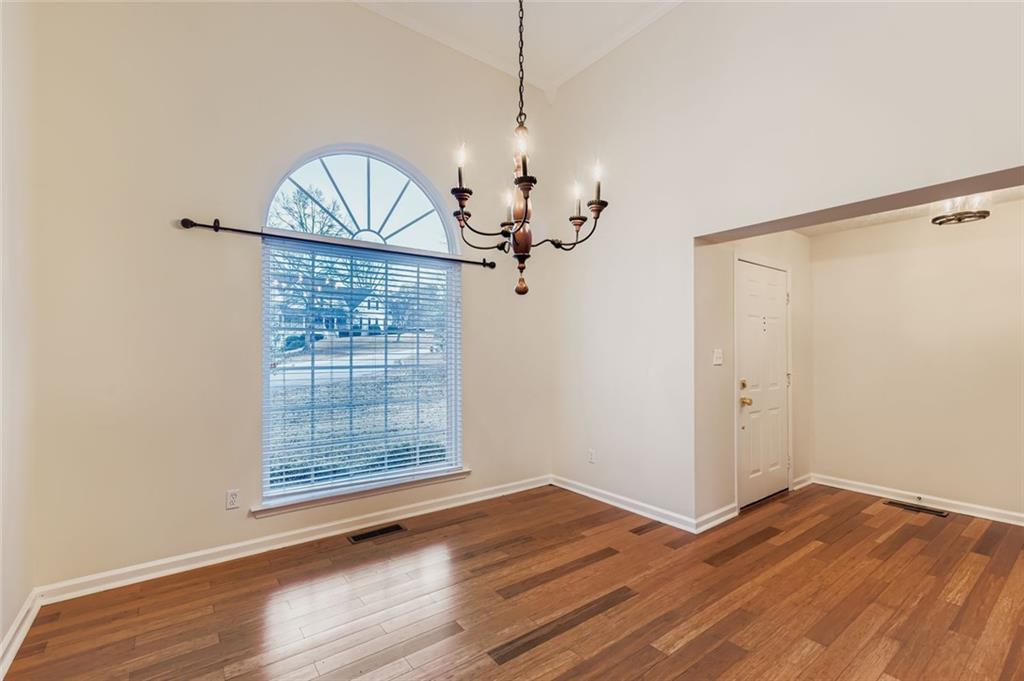 16 Inland Point Newnan, GA 30263 - Photo 3 of 34 a view of a room with wooden floor chandelier and windows