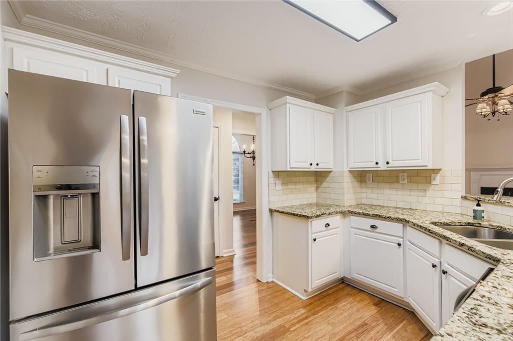 16 Inland Point Newnan, GA 30263 - Photo 8 of 34 a kitchen with a refrigerator sink and cabinets