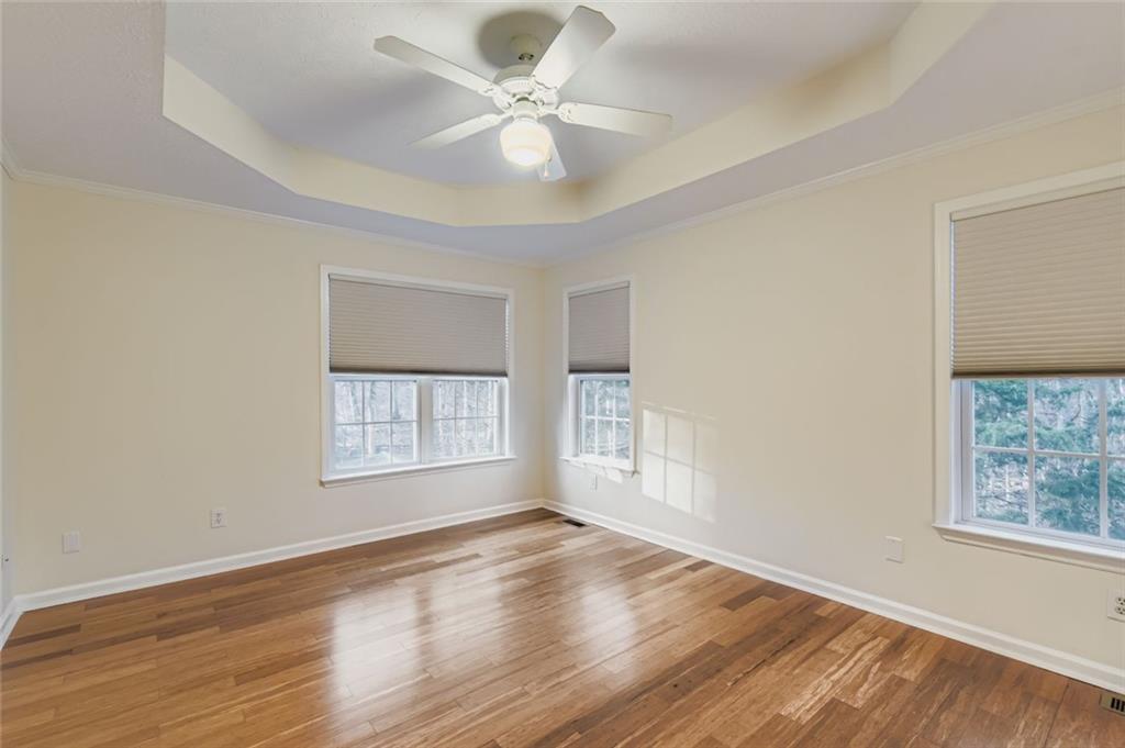 16 Inland Point Newnan, GA 30263 - Photo 10 of 34 a view of an empty room with a window and wooden floor