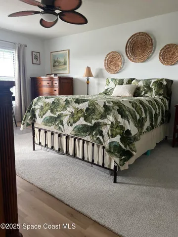 a bedroom with a bed and lamp