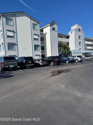 a view of a street with cars