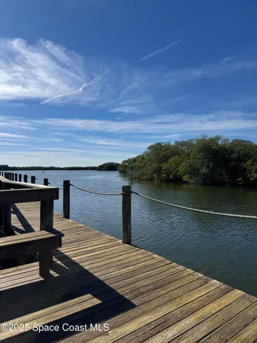 a swimming pool with outdoor seating and yard