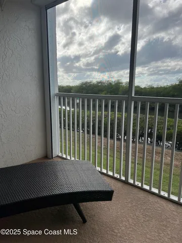 a view of a balcony with an ocean view