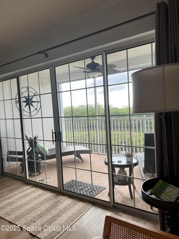 a living room view with hardwood floor and furniture