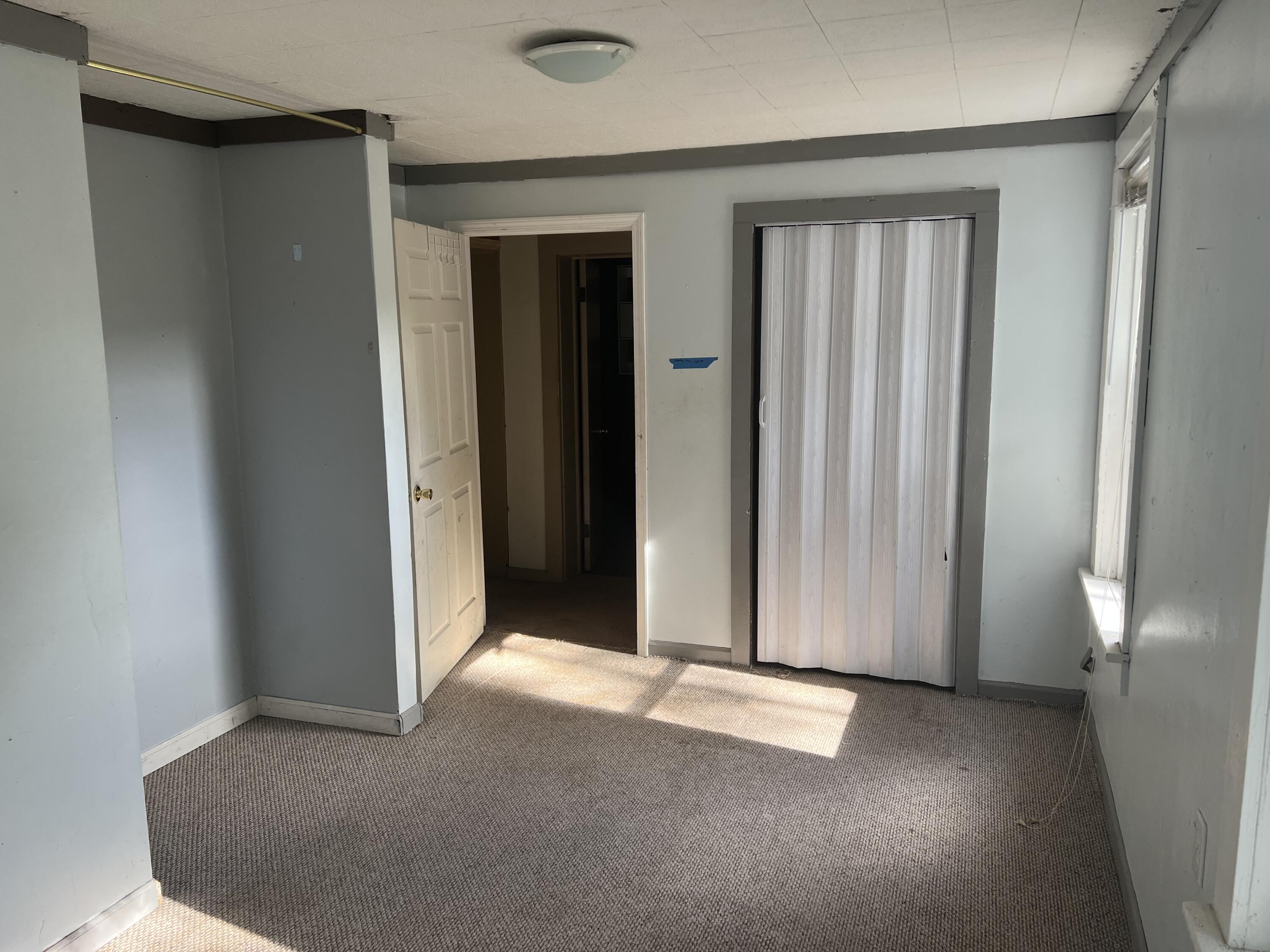 1110 Brookhaven Drive Covington, VA 24426 - Photo 7 of 11 an empty room with windows