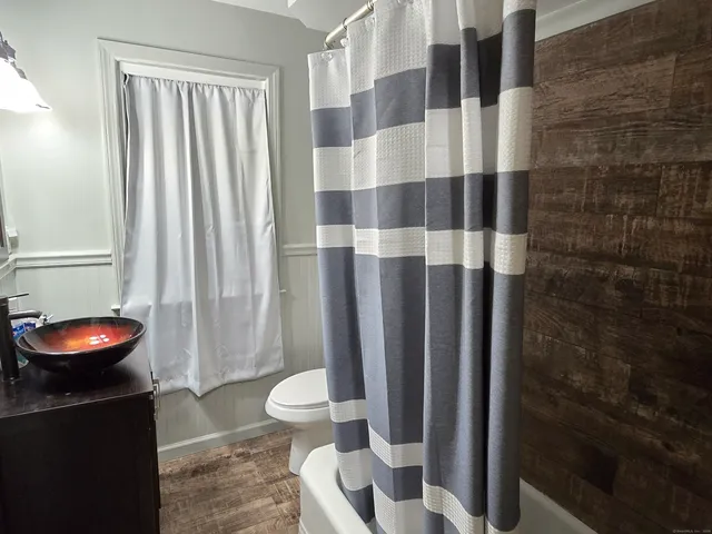 a bathroom with a sink and a shower