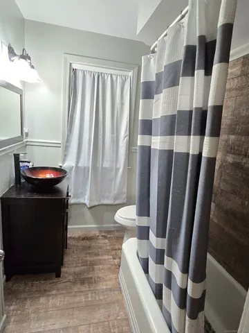 a view of bathroom with bathtub and shower