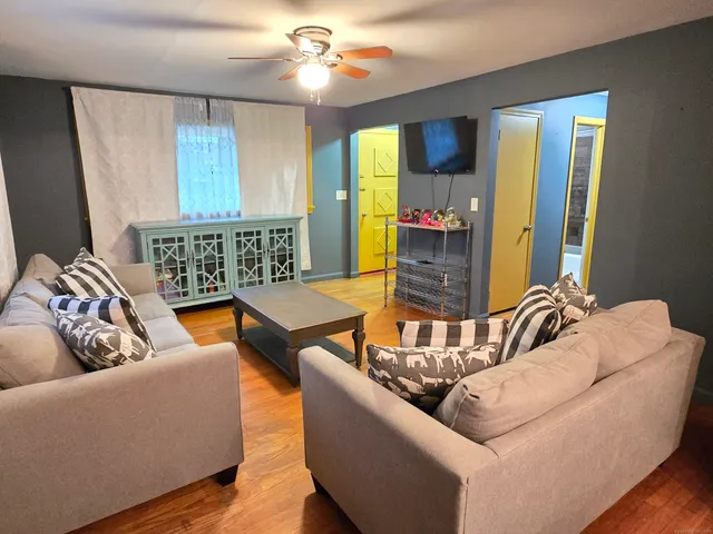 a living room with furniture and a large window