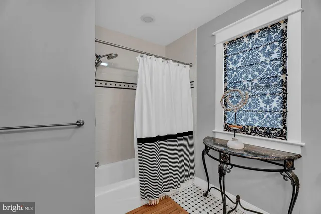 a view of a hallway with seating area