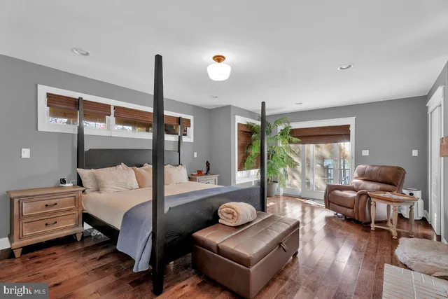 a bedroom with furniture and a window