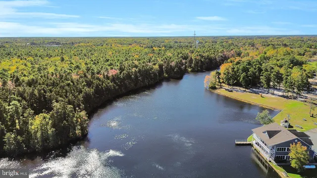 an aerial view of a house with yard swimming pool and outdoor seating