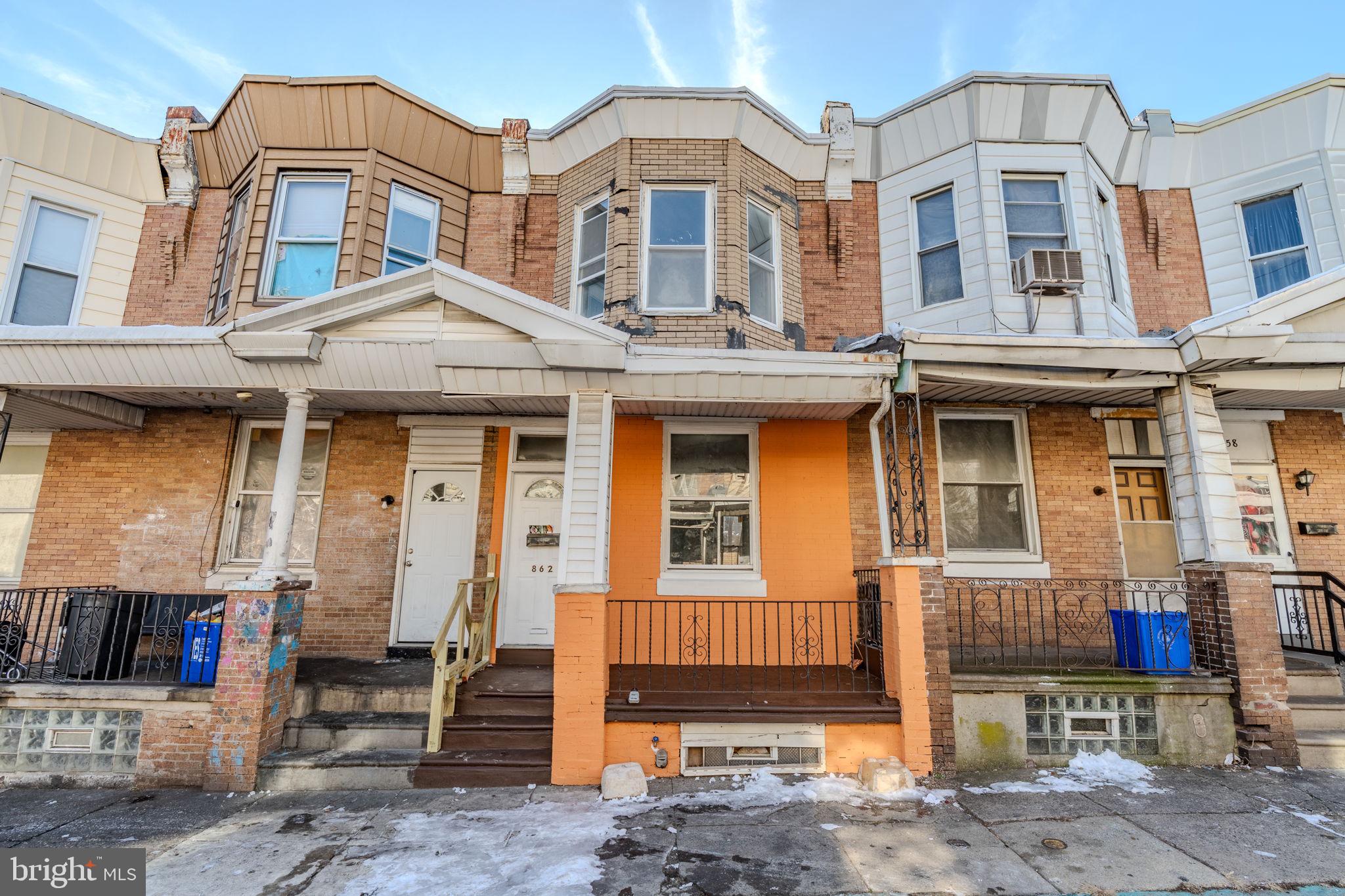 Charming row home with vibrant accents.