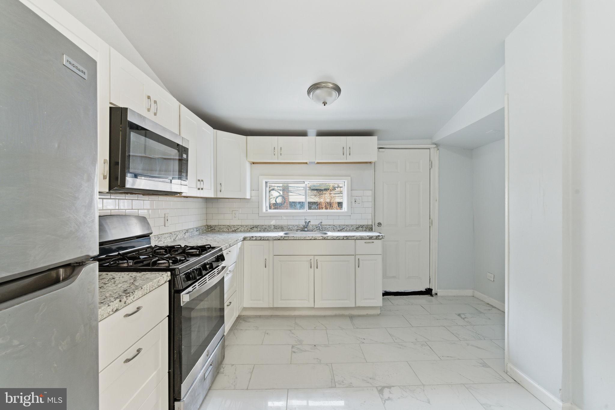 862 East Cornwall Street Philadelphia, PA 19134 - Photo 7 of 16 Modern kitchen with sleek finishes.