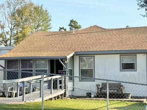 a view of house with a swimming pool