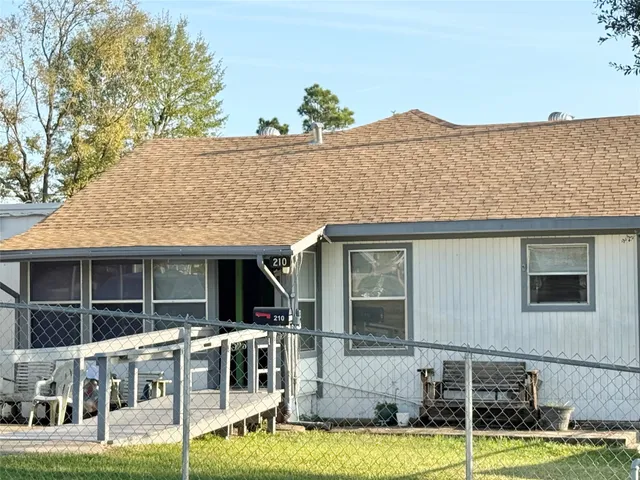 a view of house with a swimming pool