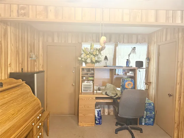 a workspace with furniture and a window