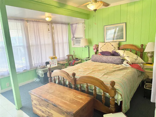 a bedroom with a bed and a table