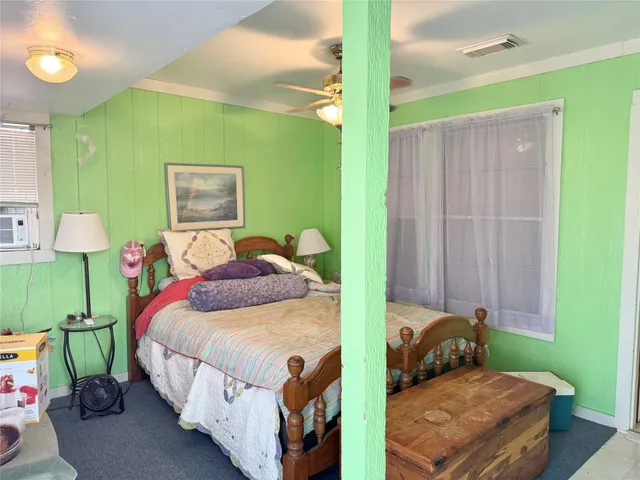 a bedroom with a bed and a table