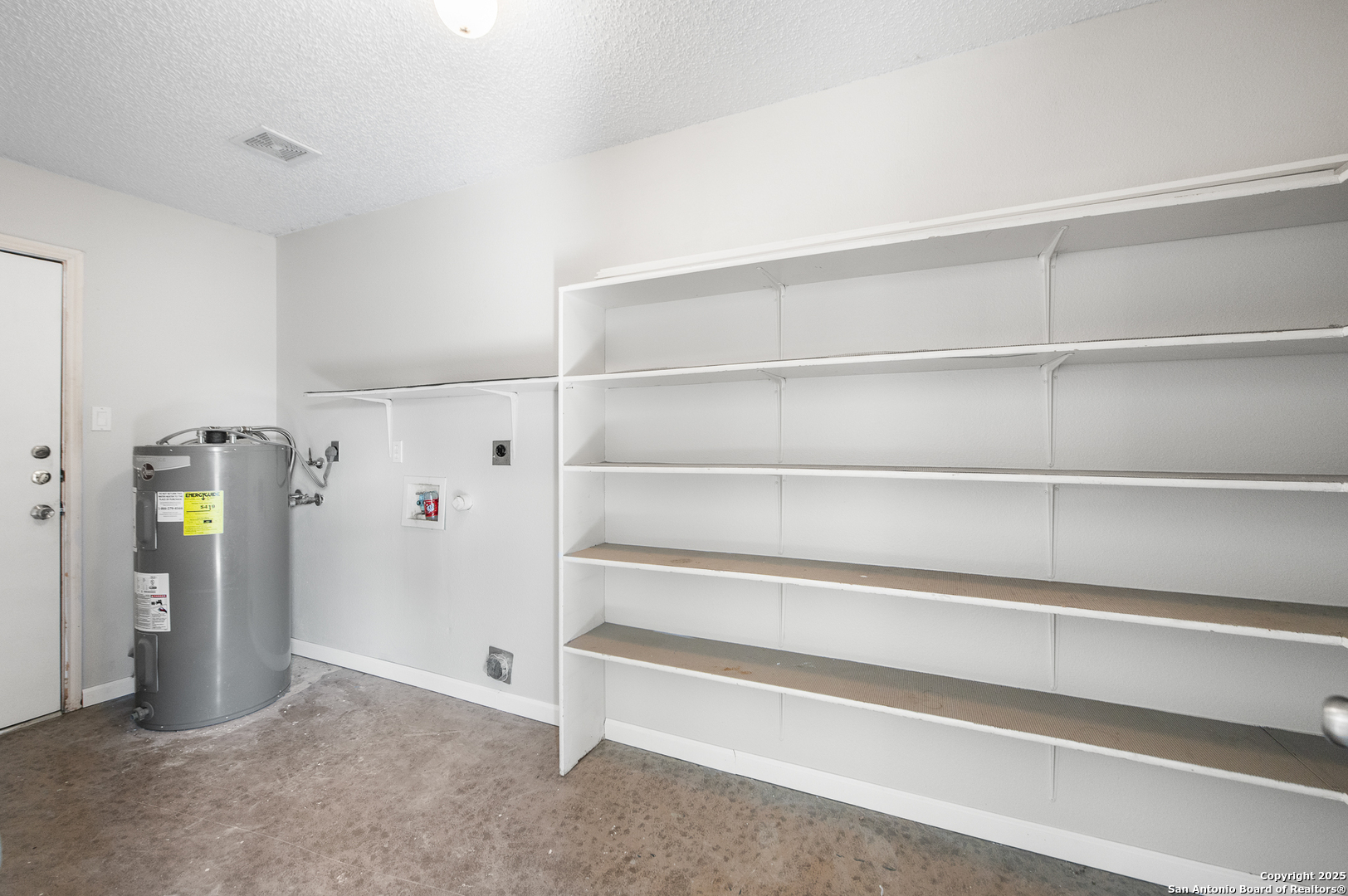 8010 Chestnut Gate Drive Converse, TX 78109 - Photo 20 of 37 a view of walk in closet with empty racks