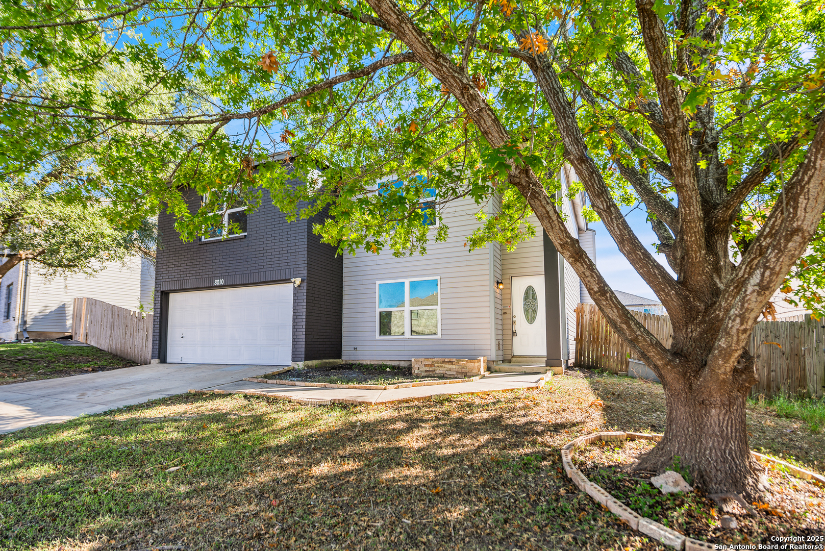 8010 Chestnut Gate Drive Converse, TX 78109 - Photo 3 of 37 a front view of a house with a yard and garage