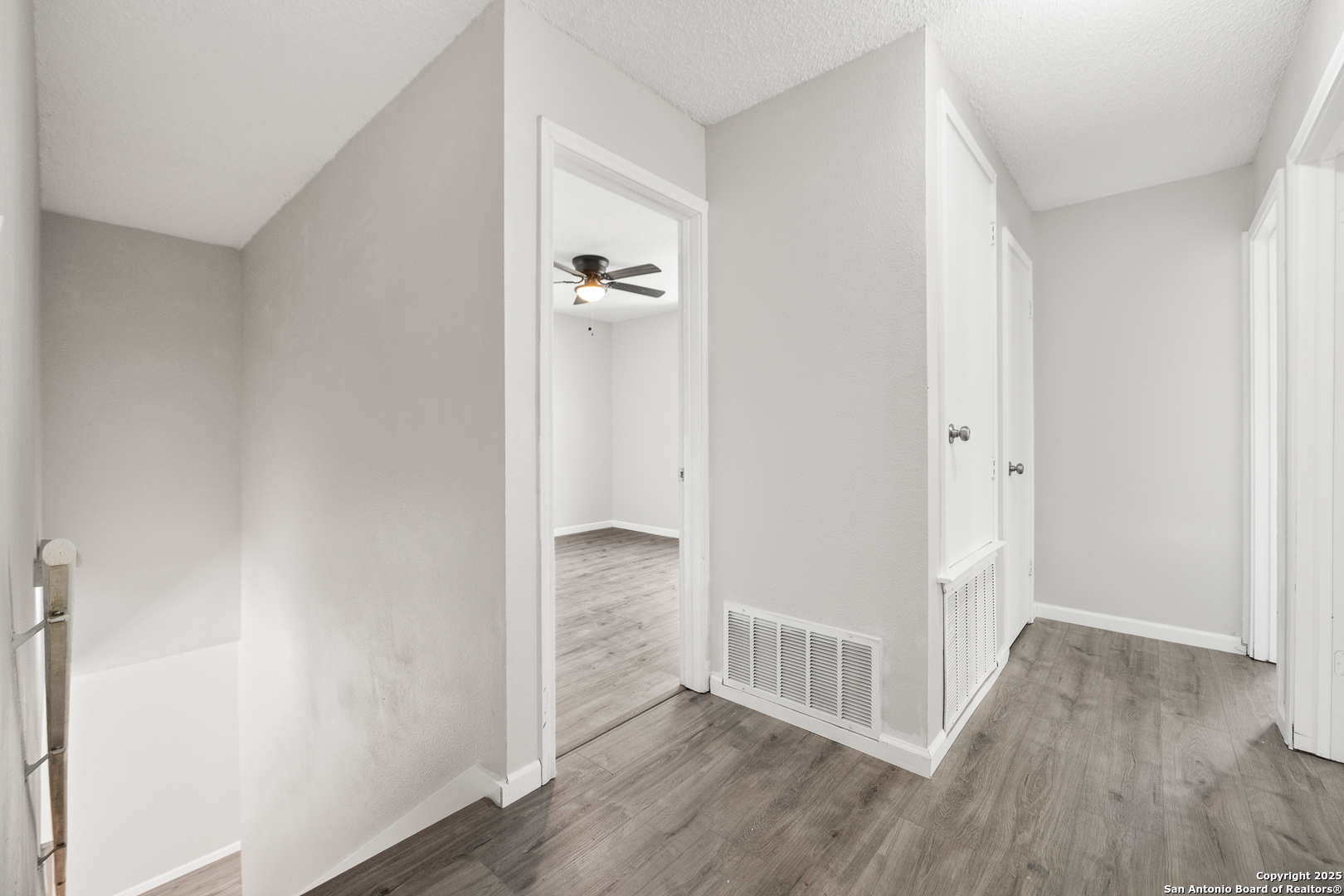 8010 Chestnut Gate Drive Converse, TX 78109 - Photo 36 of 37 a view of a hallway with wooden floor