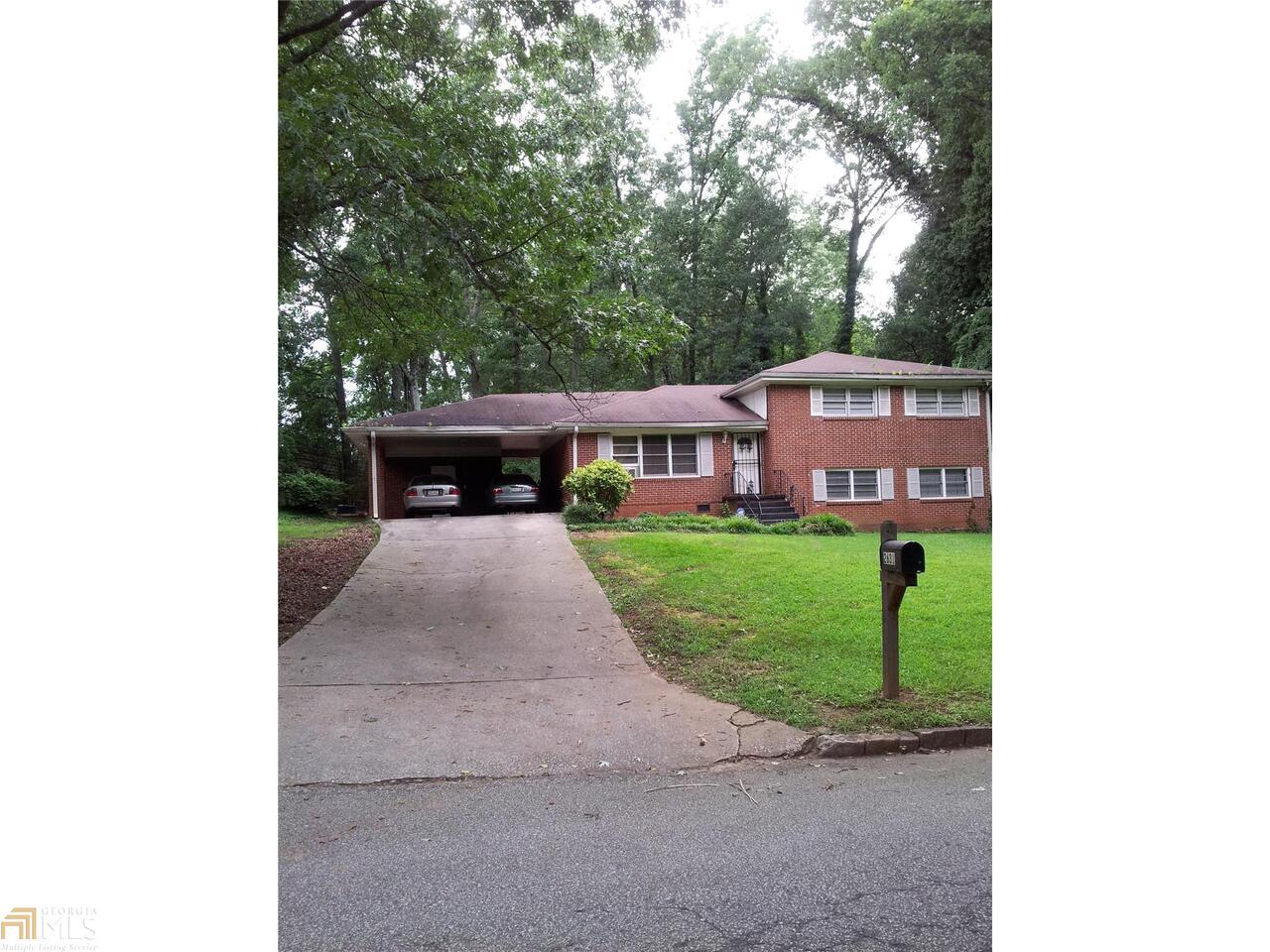 2631 Dawn Drive Decatur, GA 30032 - Photo 1 of 1 a front view of a house with a yard and trees