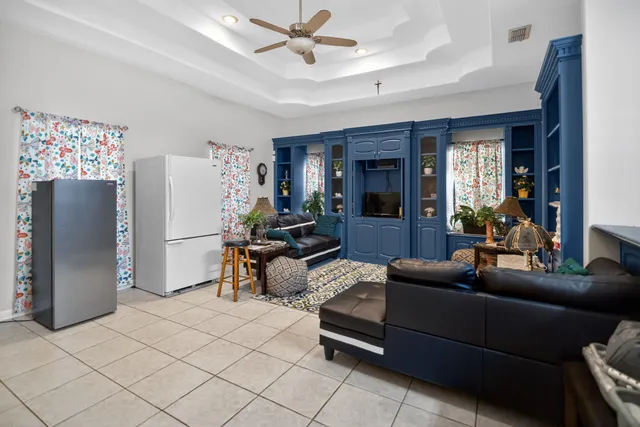 a kitchen with kitchen island a sink counter top space a stove and refrigerator