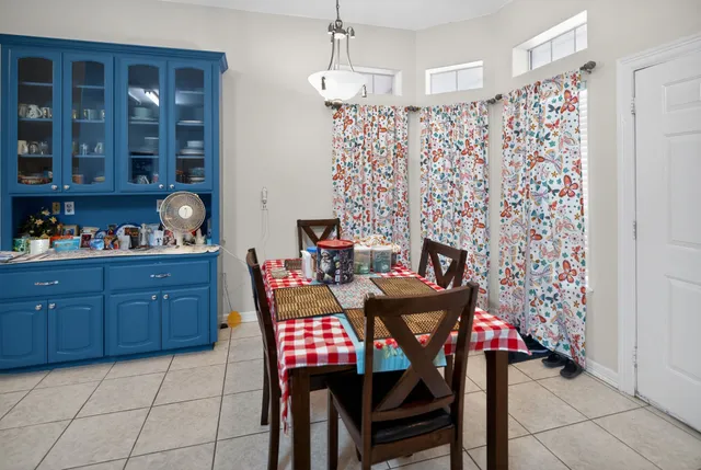 a dining room with furniture and window