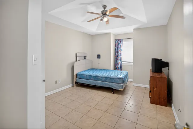 a bedroom with furniture and a window