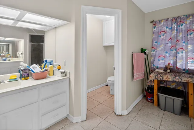 a room with furniture and a potted plant